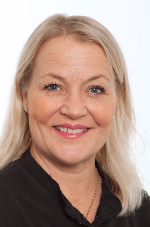 Et nærbilde av en person som smiler Et nærbilde av en person som smiler